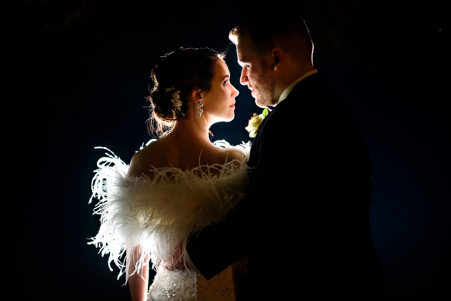 A classy portrait of a bride and groom on their wedding day.
